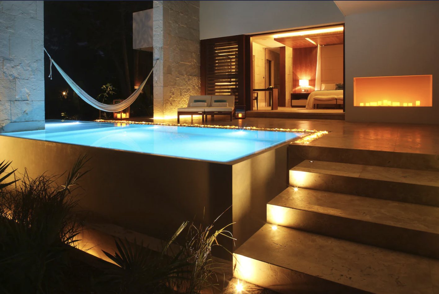 Private villa pool illuminated at night at Chablé Yucatán