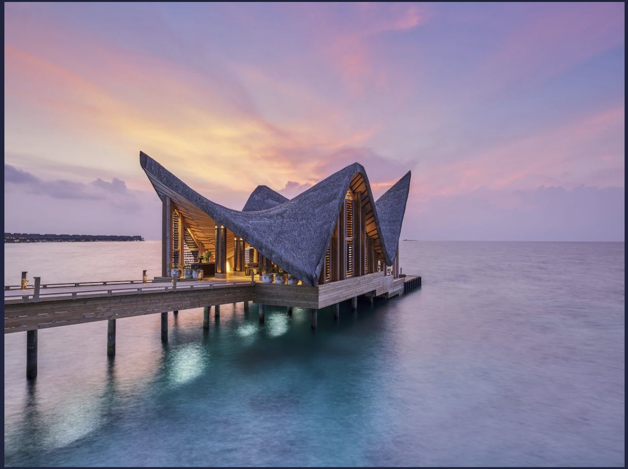 JOALI Maldives overwater pavilion at sunset