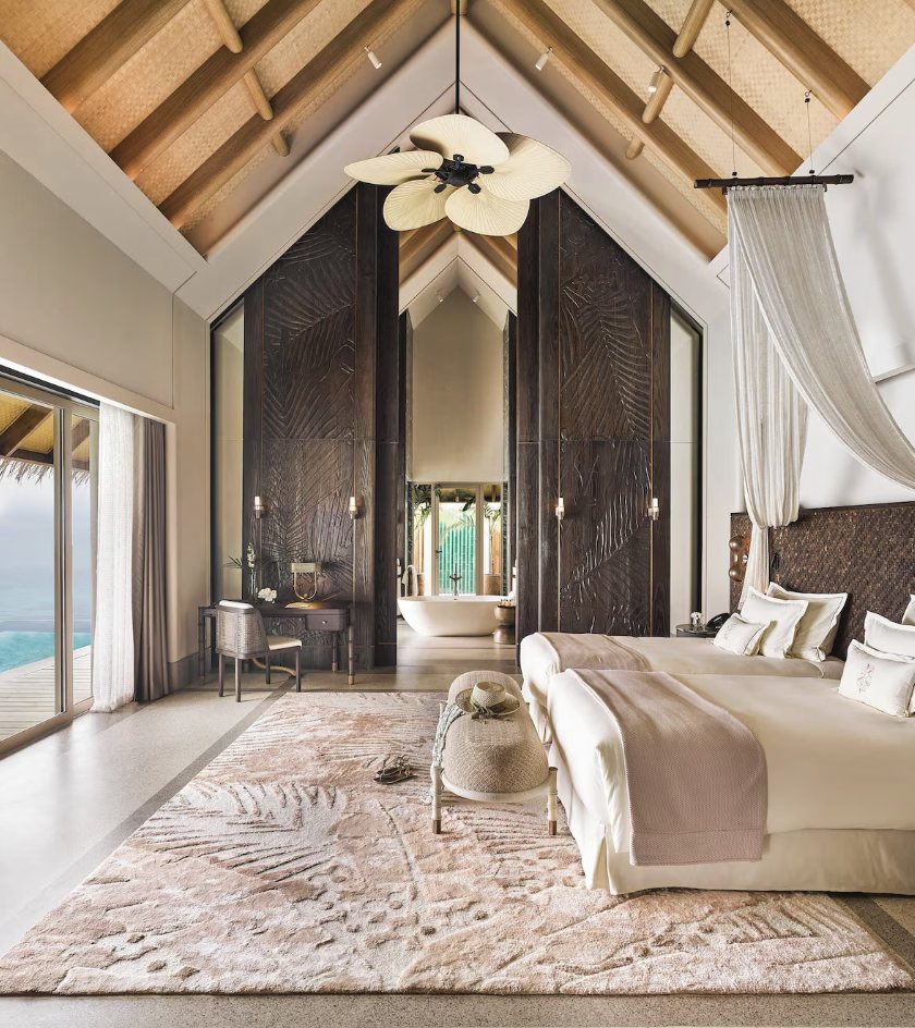 Airy villa bedroom at JOALI Maldives
