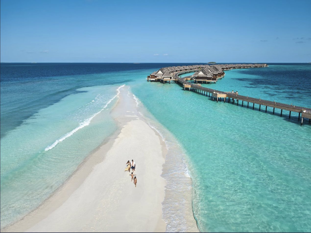 Aerial view of the sandbar and overwater villas at JOALI Maldives
